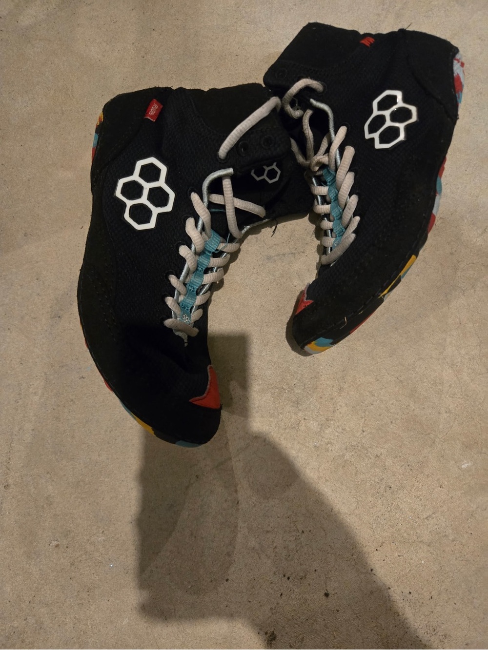 Men's Black High-Top Sneakers with Multicolor Sole Accents